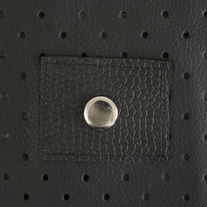 Close-up of a textured black PU leather patch with a metal button