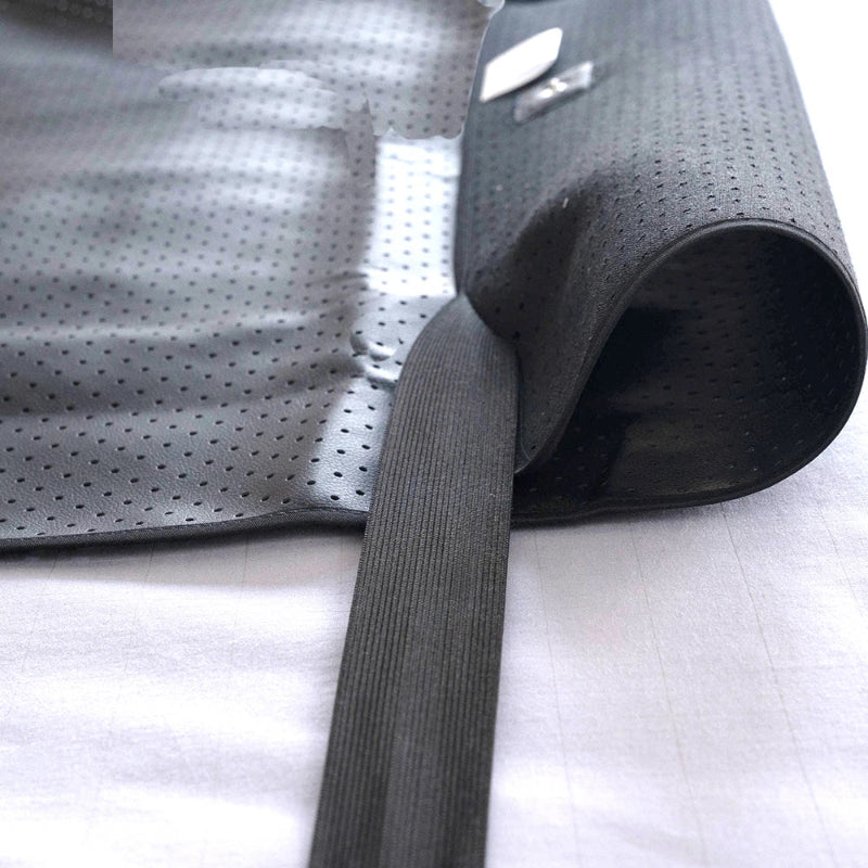 Grounding sheet with elastic in detail showing the textured surface of the UP Leather material on a white background