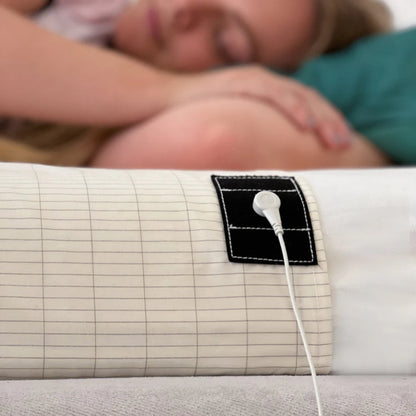 woman sleeping on top of the grounding sheet with the chord 