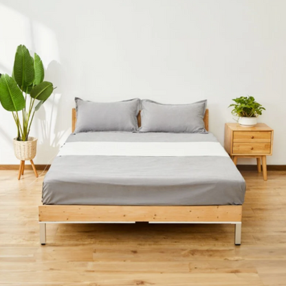 wooden bed with grounding sheet on top