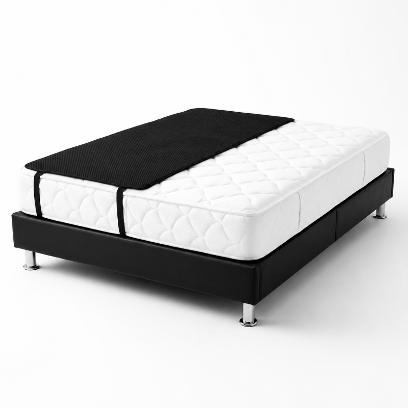 A modern bed frame with a black upholstered base and silver metal legs, shown with a white quilted mattress and a grounding sheet a clean white background.