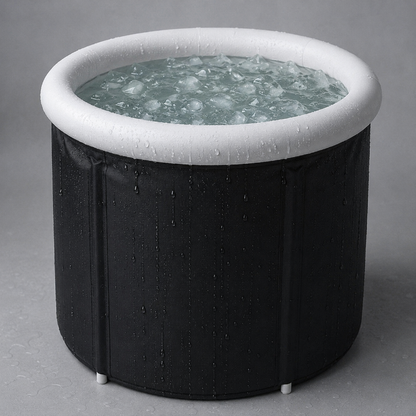 Black inflatable ice bath with water and ice on a gray background